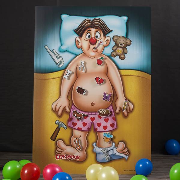Image from the kids game Operation with a sick man in bed. He has a thermometer in his mouth and and is covered in comfort times (cupcakes, strawberries, a teddy bear) and hardware tools.