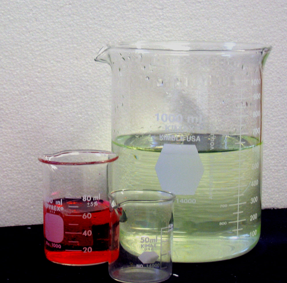 3 Beakers with various chemicals in them