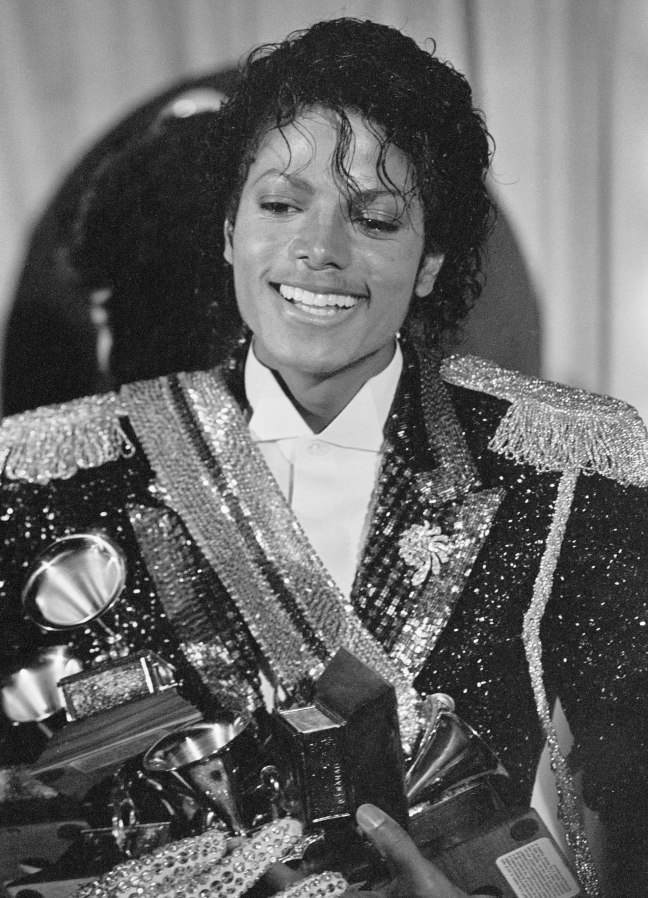 Michael Jackson in his military-style regal outfit receiving a grammy.