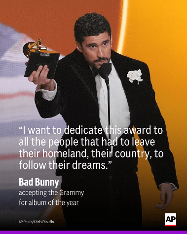 Bad Bunny holding a grammy. "I want to dedicate this award to all the people that had to leave their homeland, their country, to follow their dreams." "Bad Bunny accepting  the Grammy for album of the year." AP Photo/ Chris Pizzello